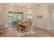 Dining area with wood table, chairs, and sliding glass doors to the patio at 5097 Faberge Pl, Sarasota, FL 34233