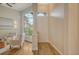 Inviting foyer with natural light, wood floors, and neutral decor at 5097 Faberge Pl, Sarasota, FL 34233