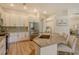 Bright kitchen with stainless steel appliances, granite countertops, and a large island with seating at 5097 Faberge Pl, Sarasota, FL 34233