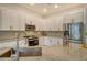 Well-appointed kitchen with stainless steel appliances, granite countertops, and ample cabinet space at 5097 Faberge Pl, Sarasota, FL 34233