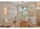 Comfortable seating area with large windows, natural light, and neutral decor at 5097 Faberge Pl, Sarasota, FL 34233