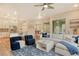 Spacious living room with an open layout, seamlessly connecting the kitchen and dining area at 5097 Faberge Pl, Sarasota, FL 34233