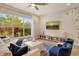 Inviting living room featuring a large window with natural light and stylish, comfortable seating at 5097 Faberge Pl, Sarasota, FL 34233