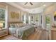 Spacious main bedroom with tray ceilings, large windows, and natural light at 5097 Faberge Pl, Sarasota, FL 34233