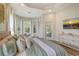 Luxurious main bedroom with a king-size bed and large windows at 5097 Faberge Pl, Sarasota, FL 34233