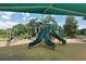 Spacious playground with slides, climbing structures, and a safe, wood-chip surface at 5097 Faberge Pl, Sarasota, FL 34233
