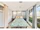 Bedroom with large windows and ceiling fan at 514 Riverside E Dr, Bradenton, FL 34208