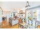 Open concept dining area with glass table and hardwood floors at 514 Riverside E Dr, Bradenton, FL 34208