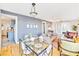 Bright dining area with glass table and kitchen view at 514 Riverside E Dr, Bradenton, FL 34208