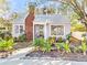 Quaint house with metal roof and landscaped yard at 514 Riverside E Dr, Bradenton, FL 34208