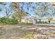 House exterior showcasing side yard and carport at 514 Riverside E Dr, Bradenton, FL 34208