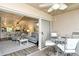 Open-air balcony with view of living room and patio furniture at 5261 Mahogany Run Ave # 624, Sarasota, FL 34241