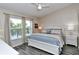 Bright bedroom with a king-size bed and large windows at 5261 Mahogany Run Ave # 624, Sarasota, FL 34241
