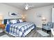 King-size bed, and sitting chair in a comfortable bedroom at 5261 Mahogany Run Ave # 624, Sarasota, FL 34241