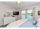 Spacious bedroom with lake view and built-in dresser at 5261 Mahogany Run Ave # 624, Sarasota, FL 34241