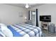 Relaxing bedroom with king-size bed and flat-screen TV at 5261 Mahogany Run Ave # 624, Sarasota, FL 34241