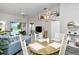 Bright dining area with wooden table and chairs at 5261 Mahogany Run Ave # 624, Sarasota, FL 34241