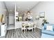 Elegant dining room with a modern table and chairs near the kitchen at 5261 Mahogany Run Ave # 624, Sarasota, FL 34241