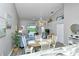 Bright dining area with a view of the living room and golf course at 5261 Mahogany Run Ave # 624, Sarasota, FL 34241