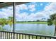 Scenic view of lake and golf course from screened porch at 5261 Mahogany Run Ave # 624, Sarasota, FL 34241