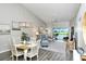 Open living room with vaulted ceilings and access to balcony at 5261 Mahogany Run Ave # 624, Sarasota, FL 34241