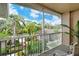 Relaxing screened balcony overlooking lush landscaping and a tranquil view at 5261 Mahogany Run Ave # 624, Sarasota, FL 34241