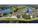 Aerial view of condo community near golf course and lake at 5281 Mahogany Run Ave # 822, Sarasota, FL 34241