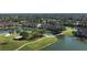 Aerial view showcasing community's location near lake and golf course at 5281 Mahogany Run Ave # 822, Sarasota, FL 34241