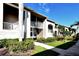 Condo building showcasing walkway, landscaping, and building details at 5281 Mahogany Run Ave # 822, Sarasota, FL 34241