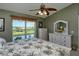 Main bedroom with golf course views and a ceiling fan at 5281 Mahogany Run Ave # 822, Sarasota, FL 34241