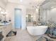 Bathroom boasts a freestanding tub, walk-in shower, and elegant tile design at 536 Ketch Ln, Longboat Key, FL 34228