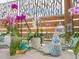 Various potted orchids and other plants on a patio at 536 Ketch Ln, Longboat Key, FL 34228
