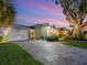 Two-car garage, and nicely landscaped lawn at 536 Ketch Ln, Longboat Key, FL 34228