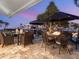 Outdoor patio space with dining area and fire pit feature at 536 Ketch Ln, Longboat Key, FL 34228