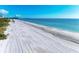 Scenic beach view with white sand and ocean at 545 Sanctuary Dr # B-504, Longboat Key, FL 34228