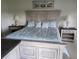 Spacious bedroom with large bed, nightstands, and calming decor at 5492 Hampstead Heath # 11, Sarasota, FL 34235