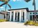 Modern clubhouse with grand entrance and landscaping at 5492 Hampstead Heath # 11, Sarasota, FL 34235