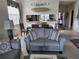 Casual dining area with seating for four and kitchen access at 5492 Hampstead Heath # 11, Sarasota, FL 34235