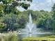 Serene fountain in a lush, green landscape at 5492 Hampstead Heath # 11, Sarasota, FL 34235