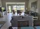Bright living room with comfortable seating and view of the patio at 5492 Hampstead Heath # 11, Sarasota, FL 34235