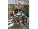 Private patio with table and chairs, perfect for outdoor dining at 5492 Hampstead Heath # 11, Sarasota, FL 34235