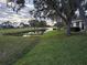 Peaceful view of a pond and golf course at 5492 Hampstead Heath # 11, Sarasota, FL 34235