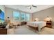 Spacious bedroom with large windows and a comfortable bed at 5601 Long Shore Loop, Sarasota, FL 34238