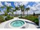 Enjoy a relaxing hot tub surrounded by lush landscaping at 5601 Long Shore Loop, Sarasota, FL 34238