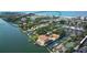 Aerial view showcasing community, waterfront, and nearby beach at 6047 E Peppertree Way # 224, Sarasota, FL 34242