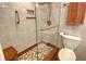 Modern bathroom with a walk-in shower and pebble floor at 6047 E Peppertree Way # 224, Sarasota, FL 34242