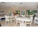 Bright and airy common area with multiple tables and chairs, perfect for gatherings at 6047 E Peppertree Way # 224, Sarasota, FL 34242