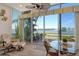 Bright dining area with water views and access to patio at 6047 E Peppertree Way # 224, Sarasota, FL 34242