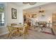 Dining area with glass table and wicker chairs at 6047 E Peppertree Way # 224, Sarasota, FL 34242