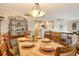 Open concept dining room with kitchen views at 6047 E Peppertree Way # 224, Sarasota, FL 34242